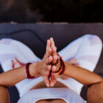 close up view of unrecognizable young asian woman doing yoga in