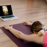 Caucasian woman practicing yoga at home